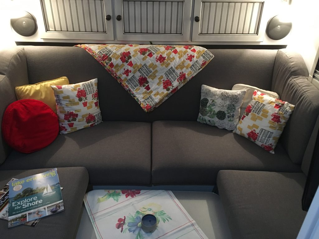 The T@bitha's sofa, all accessorized, with the table at its low setting to function as a coffee table.