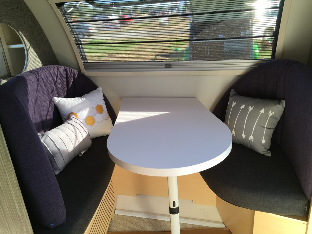 A sleek seating area with a curved design is located in the front of the TAB 400.